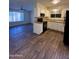 Modern flooring throughout the open concept kitchen and bright living area at 3810 W Belmont Ave, Phoenix, AZ 85051