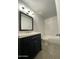 Updated bathroom with new vanity, fixtures, and shower-tub combo at 4007 W Rue De Lamour Ave, Phoenix, AZ 85029
