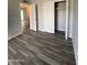 Bedroom featuring wood floors and closet with sliding doors at 4007 W Rue De Lamour Ave, Phoenix, AZ 85029