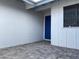 Attractive front entrance showcasing a stylish blue door and brick-paved walkway at 4007 W Rue De Lamour Ave, Phoenix, AZ 85029