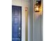 Blue front door with stylish exterior light fixture at 4007 W Rue De Lamour Ave, Phoenix, AZ 85029