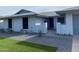 Charming single-story home with well-maintained landscaping and a welcoming entryway at 4007 W Rue De Lamour Ave, Phoenix, AZ 85029
