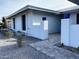 Inviting single-story home with gravel landscaping, manicured flowerbeds, and a brick-paved walkway at 4007 W Rue De Lamour Ave, Phoenix, AZ 85029