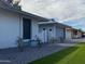 Attractive single-story home with manicured lawn and updated gray exterior paint and garage door at 4007 W Rue De Lamour Ave, Phoenix, AZ 85029