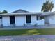 Charming single-story home with well-maintained landscaping and a welcoming entryway at 4007 W Rue De Lamour Ave, Phoenix, AZ 85029