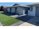 Inviting single-story home with gravel landscaping, manicured flowerbeds, and a brick-paved walkway at 4007 W Rue De Lamour Ave, Phoenix, AZ 85029