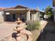 Backyard with mature trees, a fountain, and a stone bench at 4335 E Monte Way, Phoenix, AZ 85044