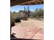Relaxing backyard patio featuring a charming fountain, desert landscaping, and patterned concrete at 4335 E Monte Way, Phoenix, AZ 85044