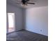 Neutral bedroom with carpet, ceiling fan, and access to a private patio at 4335 E Monte Way, Phoenix, AZ 85044