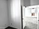 An additional bedroom, featuring neutral colors and a view into another living space at 4335 E Monte Way, Phoenix, AZ 85044
