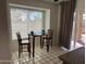Bright breakfast nook featuring a cozy table and large window with natural light at 4335 E Monte Way, Phoenix, AZ 85044