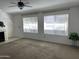 Bright living room with a fireplace, plush carpet, and plenty of natural light at 4335 E Monte Way, Phoenix, AZ 85044