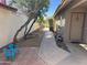 Landscaped side yard featuring pavers, rocks, and a walkway leading to the front door at 4335 E Monte Way, Phoenix, AZ 85044