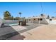 Backyard with a refreshing pool, patio, and gravel landscaping at 455 E Garfield St, Tempe, AZ 85288