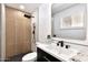 Bathroom featuring a walk-in shower, and black fixtures and hardware at 455 E Garfield St, Tempe, AZ 85288