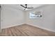 Bright bedroom featuring hardwood floors, a ceiling fan, and a window at 455 E Garfield St, Tempe, AZ 85288