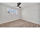 Well-lit bedroom with white walls, ceiling fan, and vinyl floors at 455 E Garfield St, Tempe, AZ 85288