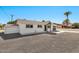 A white painted single story home with minimalist landscaping at 455 E Garfield St, Tempe, AZ 85288