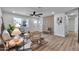 Bright living room featuring stylish seating, a decorative accent wall, and lots of natural light at 455 E Garfield St, Tempe, AZ 85288