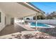 Backyard featuring a pool, covered patio, and white fencing at 455 E Garfield St, Tempe, AZ 85288