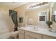 Clean bathroom featuring a shower/tub combo with curtain, vanity with sink, and neutral decor at 4744 E Casey Ln, Cave Creek, AZ 85331