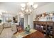 Eat-in kitchen with tile flooring, a decorative chandelier, and access to the kitchen at 4744 E Casey Ln, Cave Creek, AZ 85331