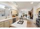 Bright kitchen featuring tile floors, white countertops, stainless steel appliances, and a center island at 4744 E Casey Ln, Cave Creek, AZ 85331