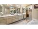 Spacious main bathroom featuring double sinks, a large mirror, and a walk-in closet at 4744 E Casey Ln, Cave Creek, AZ 85331