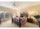 Cozy bedroom with neutral walls, a decorative bed frame, a ceiling fan and bright, natural light at 4744 E Casey Ln, Cave Creek, AZ 85331