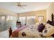 Sun-drenched bedroom showcases a decorative wrought iron bed frame and plush bedding near bright windows at 4744 E Casey Ln, Cave Creek, AZ 85331