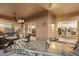 Covered patio showcasing wicker seating, glass-top table, and convenient access to the home's interior at 4744 E Casey Ln, Cave Creek, AZ 85331