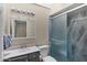 Bathroom features a vanity, toilet, and a shower with a glass enclosure at 4828 E Capistrano Ave, Phoenix, AZ 85044