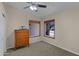 Bedroom with a ceiling fan, carpet flooring and windows that provide natural light at 4828 E Capistrano Ave, Phoenix, AZ 85044