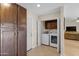 Well-organized laundry area featuring ample storage cabinets and modern washer and dryer units at 4828 E Capistrano Ave, Phoenix, AZ 85044