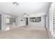 Open-concept living room featuring tile and carpet flooring, with ample natural light at 494 W Midland Ln, Gilbert, AZ 85233