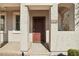 Close up of a beautiful front door framed by columns and an arched doorway at 5150 W Illini St, Phoenix, AZ 85043