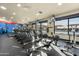 Well-lit gym boasts state-of-the-art equipment, large windows, and TVs for an immersive workout experience at 5284 S Marble Dr, Gold Canyon, AZ 85118