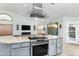 Open kitchen featuring stainless steel appliances, granite countertops, and seamless access to the living area at 5284 S Marble Dr, Gold Canyon, AZ 85118