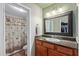 Bathroom featuring a single sink vanity with granite counters and a shower with a patterned curtain at 5335 E Shea Blvd # 2102, Scottsdale, AZ 85254