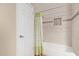 Bright bathroom featuring a tub with modern tiled walls and decorative shower curtain at 5335 E Shea Blvd # 2102, Scottsdale, AZ 85254