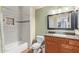 Bathroom featuring a tiled shower/tub combo, single sink vanity with granite counters and large mirror at 5335 E Shea Blvd # 2102, Scottsdale, AZ 85254