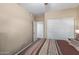 Bedroom featuring hardwood floors, a ceiling fan, neutral paint, and a closet at 5335 E Shea Blvd # 2102, Scottsdale, AZ 85254