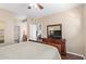 Bedroom featuring a TV on a dresser, a bed, and access to an ensuite bathroom at 5335 E Shea Blvd # 2102, Scottsdale, AZ 85254