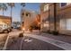 Exterior view of building with landscaped pathway, palm trees, and parking at 5335 E Shea Blvd # 2102, Scottsdale, AZ 85254