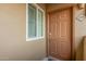 Exterior view of a condo's front door, and a window, with the unit number '2102' visible at 5335 E Shea Blvd # 2102, Scottsdale, AZ 85254