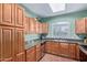 Charming kitchen featuring oak cabinets, granite countertops, and modern appliances at 5335 E Shea Blvd # 2102, Scottsdale, AZ 85254