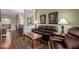 Relaxing living room with hardwood floors, a cozy sofa, and an open layout to the dining area at 5335 E Shea Blvd # 2102, Scottsdale, AZ 85254