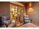 Comfortable patio seating with plush chairs, pillows, and an open view to the interior at 5335 E Shea Blvd # 2102, Scottsdale, AZ 85254