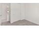 Bright and empty bedroom featuring neutral carpet, trim, and a closet with sliding doors at 5358 W Las Palmaritas Dr, Glendale, AZ 85302