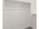 Bright and empty walk-in closet featuring wood shelf and rack at 5358 W Las Palmaritas Dr, Glendale, AZ 85302